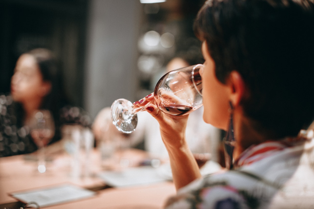 Woman drinking a glass of red wine